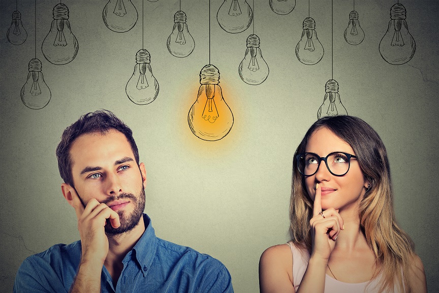 Man and woman working on their elevator pitch for their therapy practice.